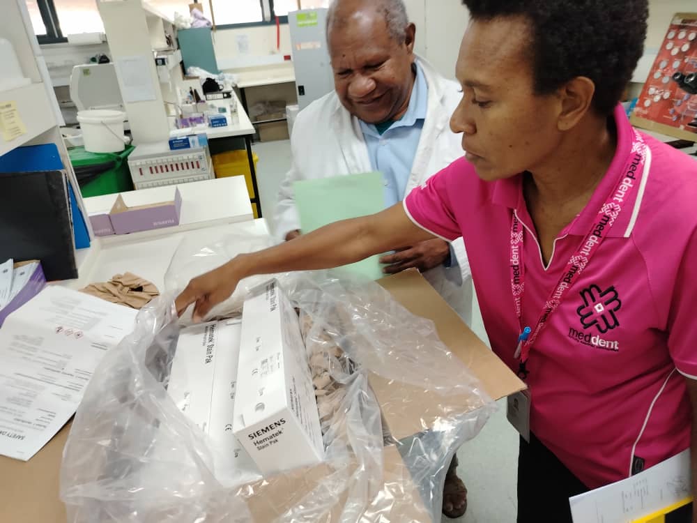 WhatsApp image of healthcare staff providing assistance during medical procedures