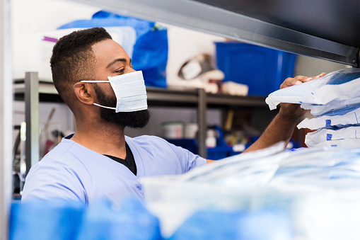 Healthcare professional using diagnostic medical equipment in a clinical environment